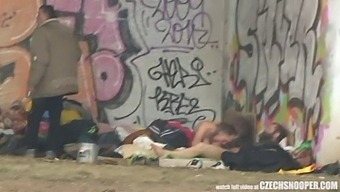 A Threesome Of Homeless Individuals Engaging In Sexual Activity In A Public Setting, Captured In Raw And Unfiltered Footage.