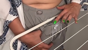 Stepson Catches His Stepmother Rubbing Her Large Penis On The Clothes Dryer In Their Home